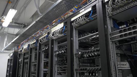 A miner carefully inspects the internal components of a mining rig, ensuring optimal performance and stability.
